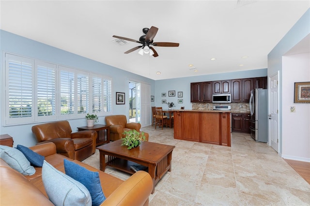 living room featuring ceiling fan