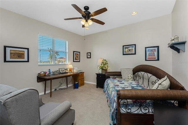 carpeted office featuring ceiling fan