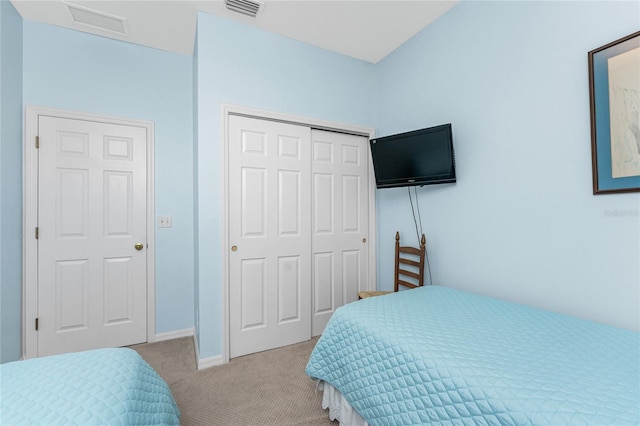 carpeted bedroom featuring a closet