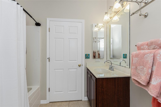 bathroom with tile patterned flooring, vanity, and shower / bathtub combination with curtain