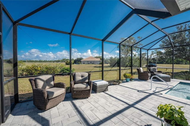 view of patio featuring a lanai