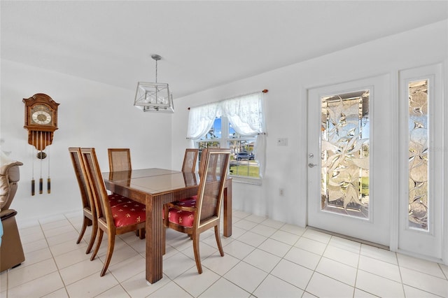 dining room featuring an inviting chandelier and light tile patterned floors