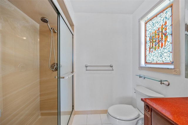 bathroom featuring walk in shower, tile patterned flooring, vanity, and toilet