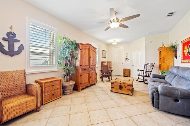 living room with light tile patterned floors and ceiling fan