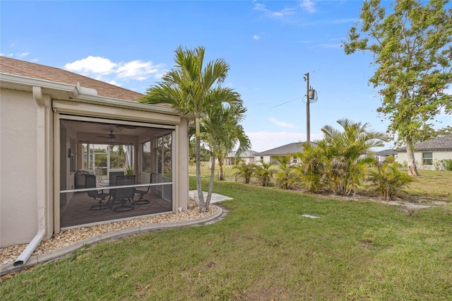 view of yard featuring a sunroom