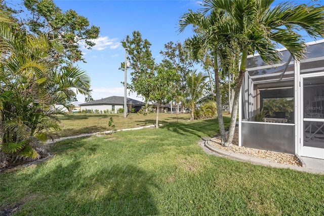 view of yard with a lanai