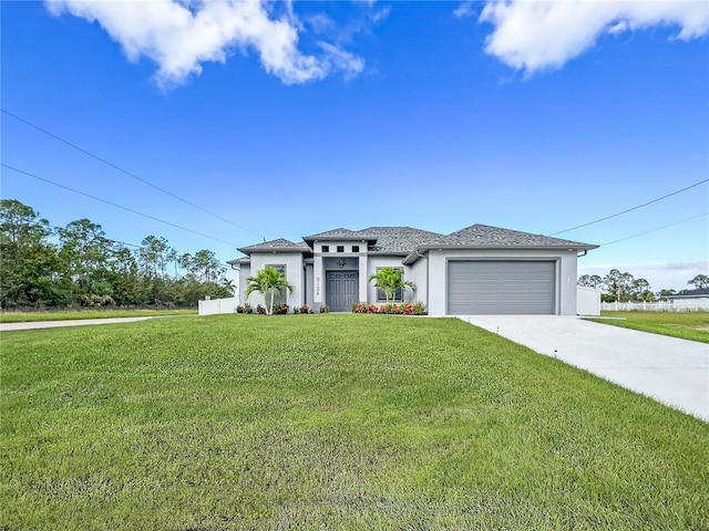 view of front of house featuring a front yard and a garage