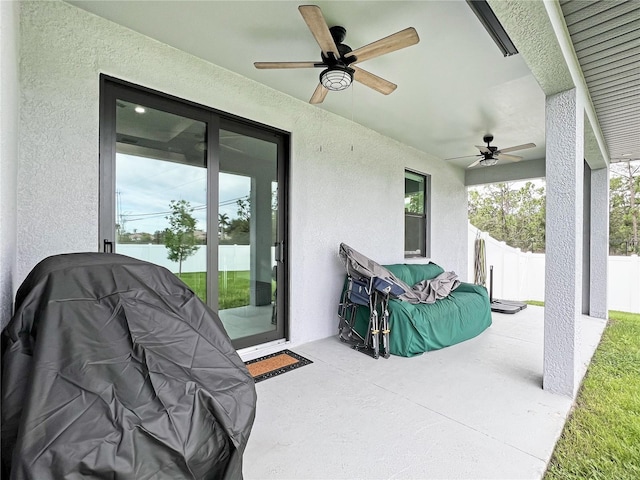 view of patio featuring ceiling fan