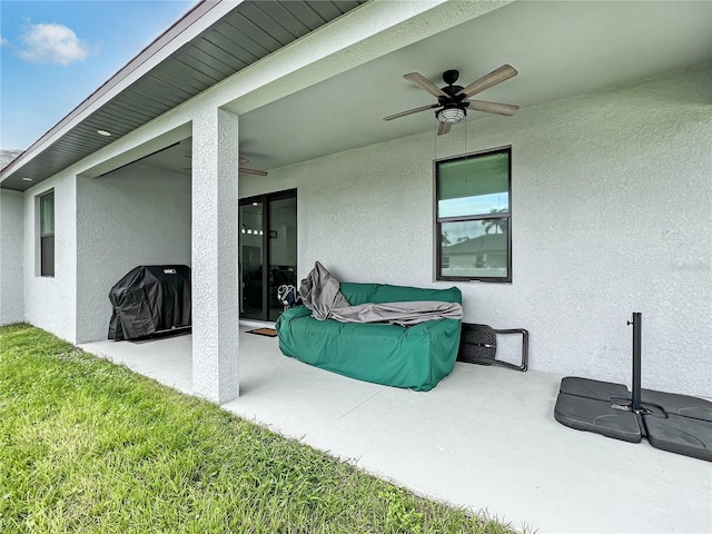 view of patio featuring ceiling fan and grilling area