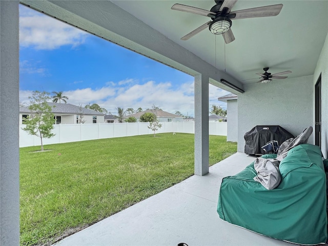 view of patio / terrace with ceiling fan and a grill