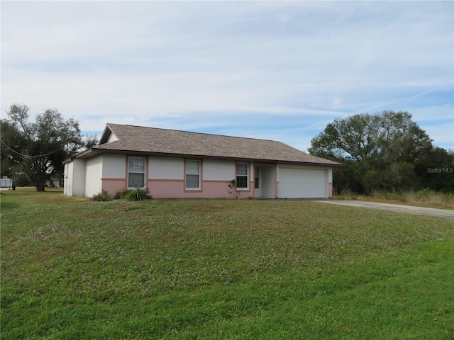 ranch-style house with a front yard and a garage