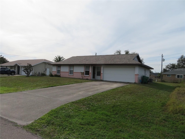 single story home featuring a garage and a front yard