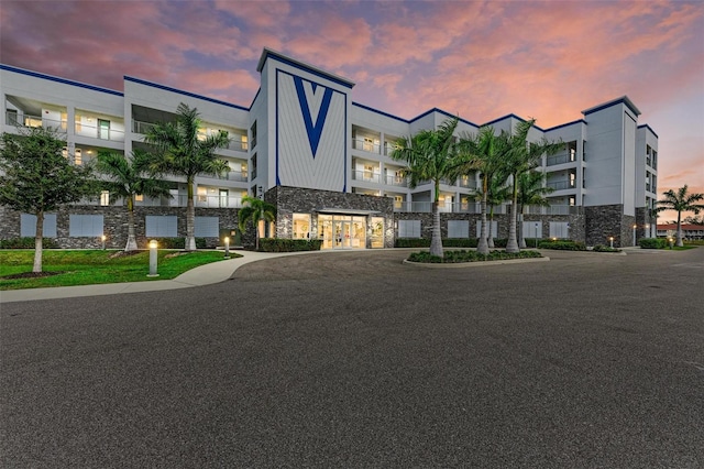 view of outdoor building at dusk