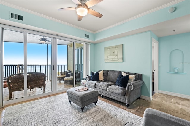 living room featuring ceiling fan and ornamental molding