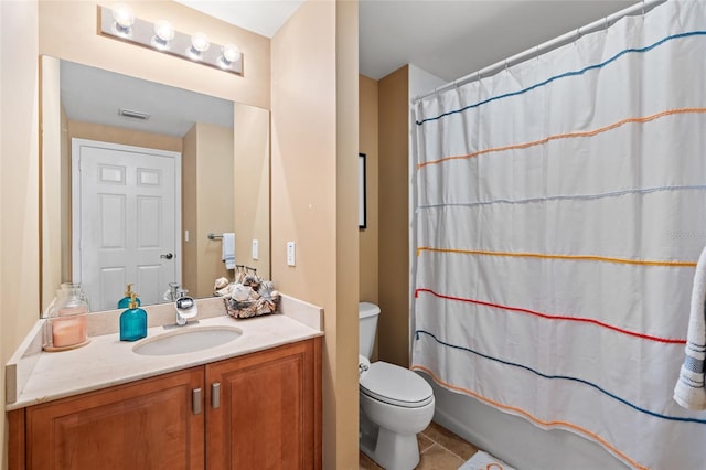 full bathroom with tile patterned flooring, vanity, shower / tub combo with curtain, and toilet