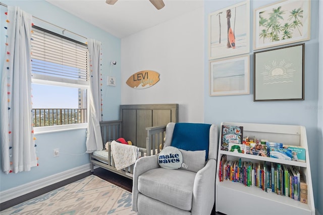 sitting room featuring ceiling fan and hardwood / wood-style floors