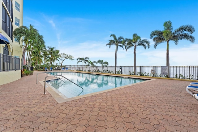 view of swimming pool with a patio