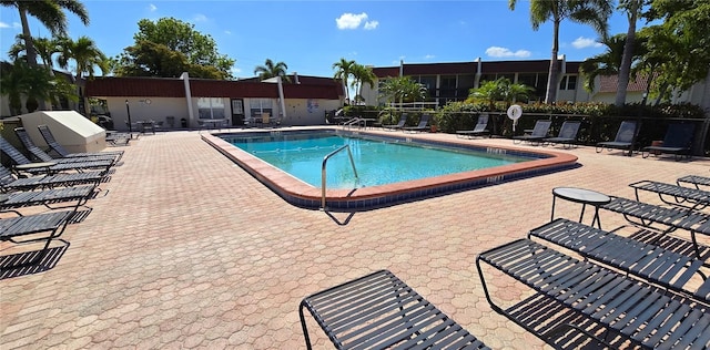 view of swimming pool with a patio