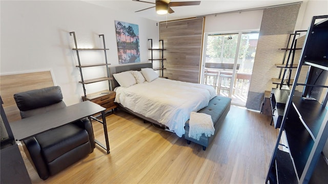 bedroom with access to exterior, ceiling fan, and light hardwood / wood-style flooring