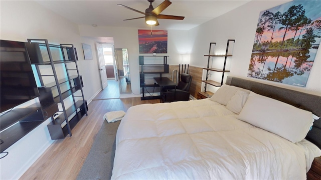 bedroom with ceiling fan and light wood-type flooring