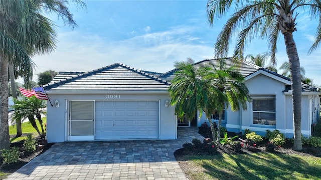 single story home featuring a garage