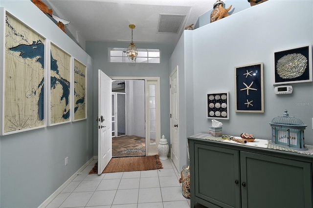 entryway featuring light tile patterned floors