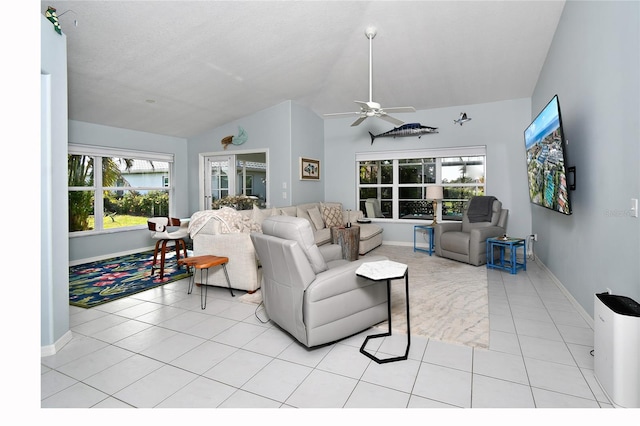 tiled living room with ceiling fan and vaulted ceiling