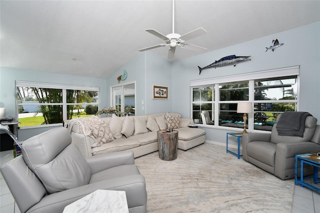 tiled living room featuring ceiling fan and lofted ceiling