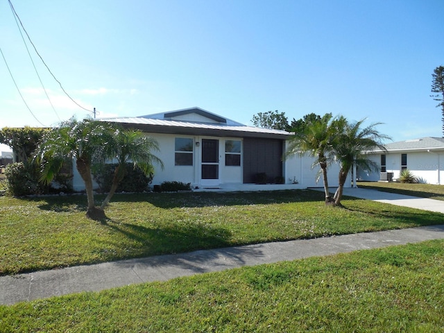 single story home featuring a front yard