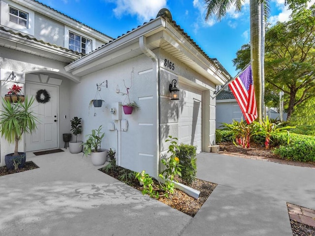 view of property exterior featuring a garage