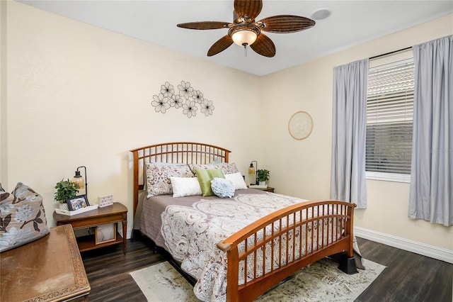 bedroom with ceiling fan and dark hardwood / wood-style flooring