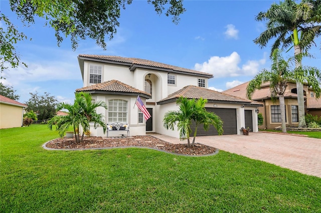 mediterranean / spanish-style house with a front yard