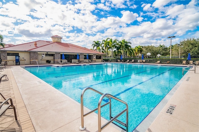 view of pool featuring a patio