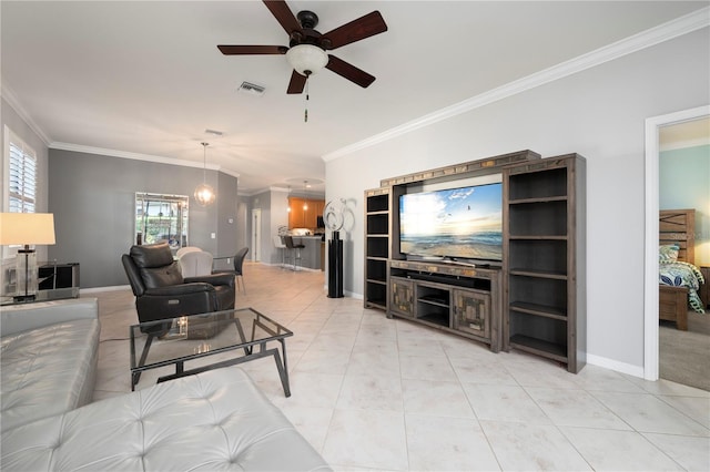 living room featuring crown molding, ceiling fan, and light tile patterned floors