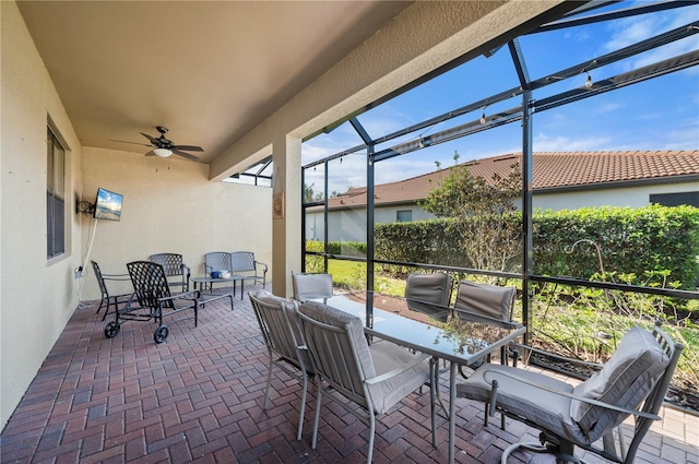 sunroom / solarium with ceiling fan