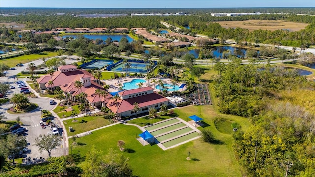 birds eye view of property with a water view