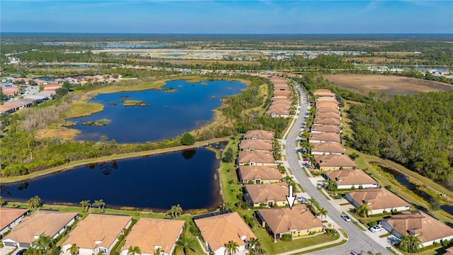 bird's eye view featuring a water view and a residential view