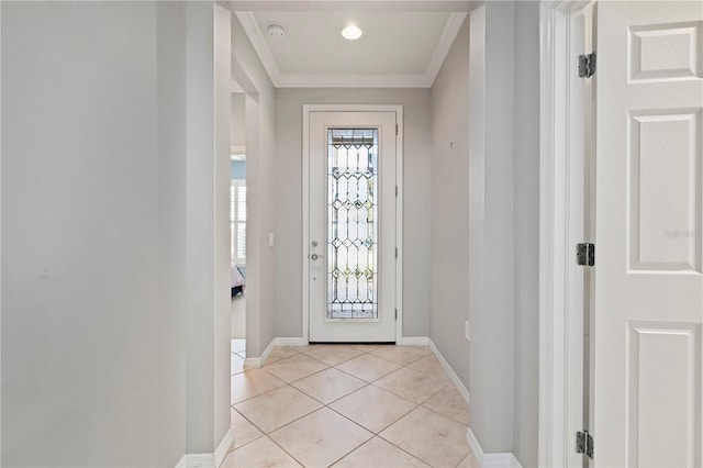 foyer entrance featuring baseboards, crown molding, and light tile patterned flooring