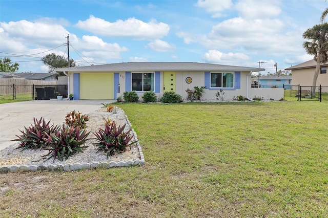 ranch-style home featuring a garage and a front yard