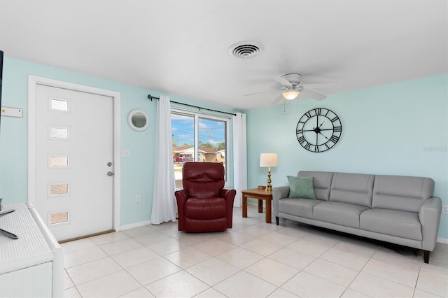 tiled living room featuring ceiling fan