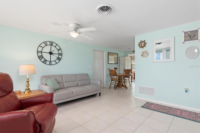 living room featuring ceiling fan and light tile patterned floors