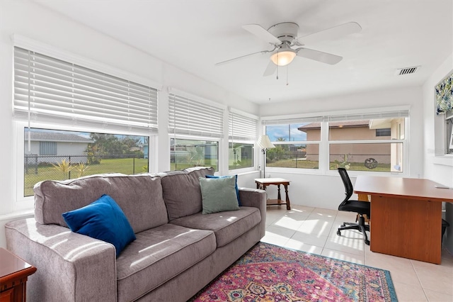 interior space with ceiling fan