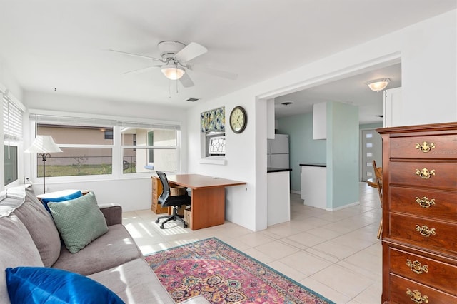 tiled home office with ceiling fan