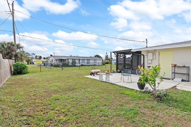 view of yard with a patio and a sunroom