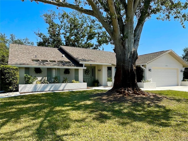 ranch-style home featuring a garage, a shingled roof, a front lawn, and stucco siding