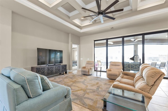 living room with a high ceiling, coffered ceiling, ceiling fan, ornamental molding, and beamed ceiling