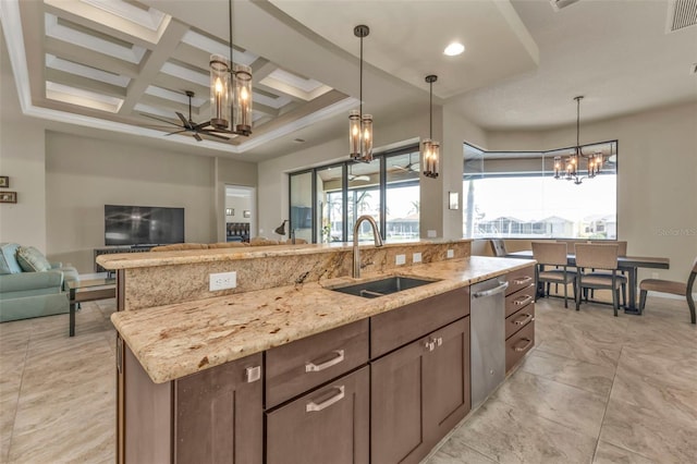 kitchen featuring light stone counters, coffered ceiling, ceiling fan, sink, and dishwasher