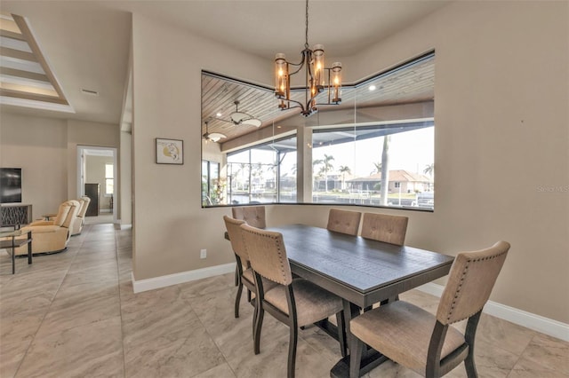 dining space featuring plenty of natural light and an inviting chandelier