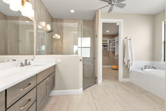 bathroom featuring shower with separate bathtub, vanity, and ceiling fan