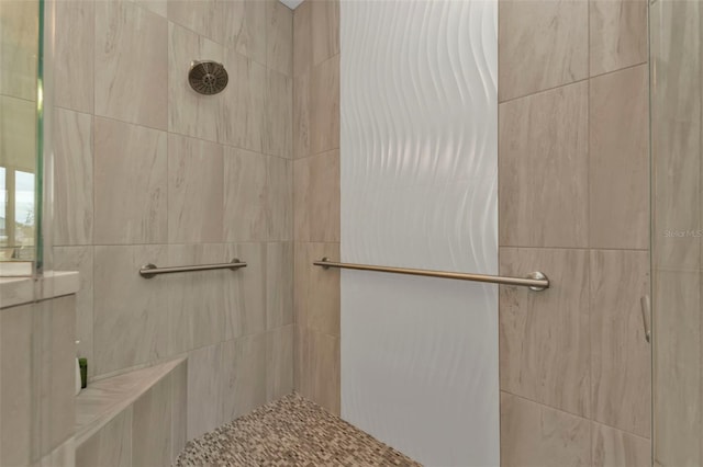 bathroom with tiled shower